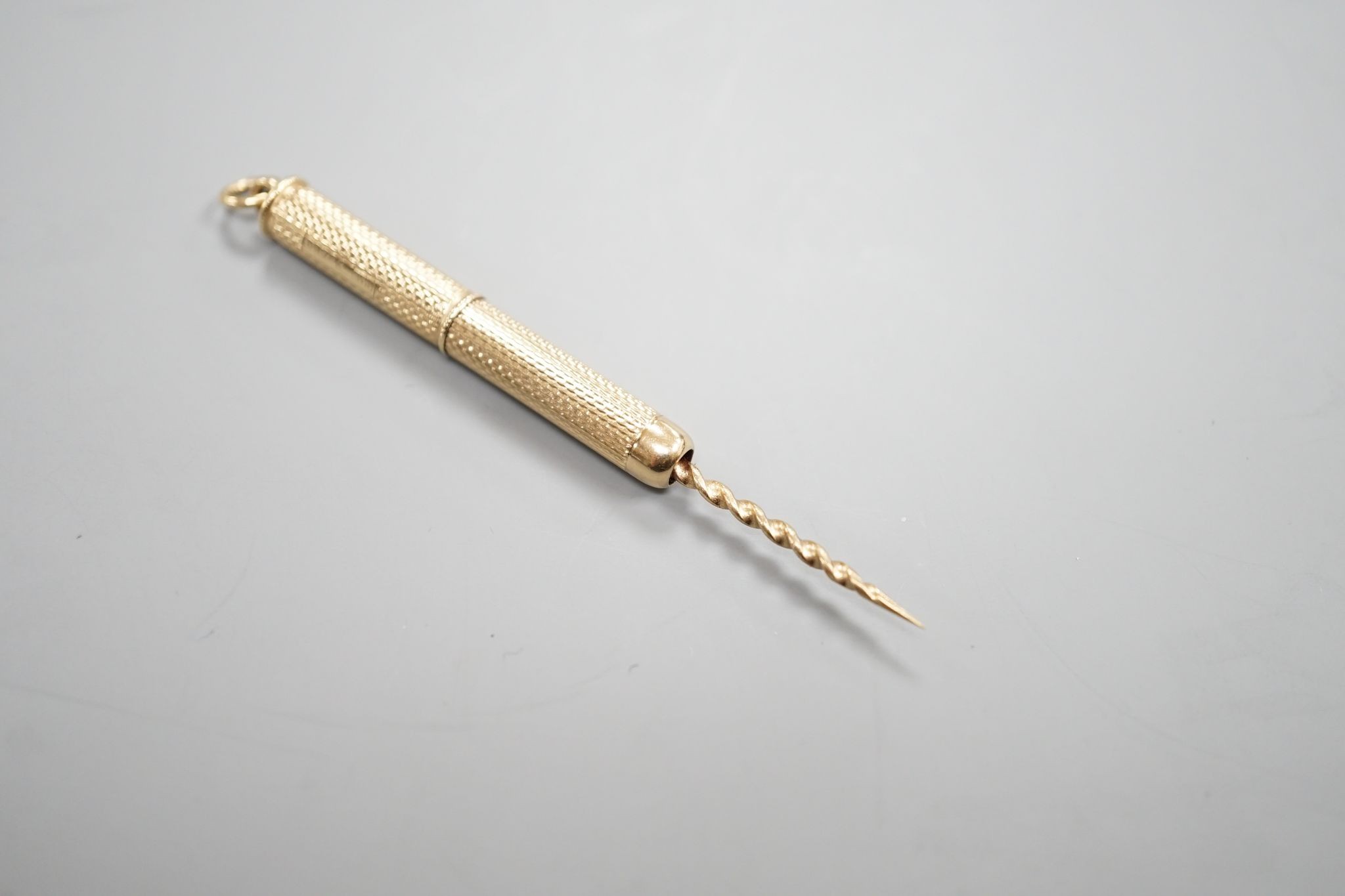 A A 1960' 9ct gold cased propelling toothpick, 46mm.